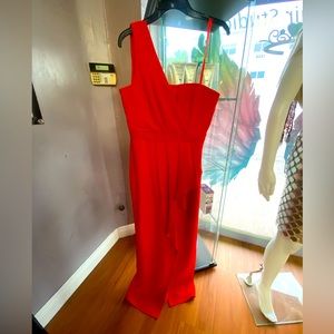One shoulder beautiful asymmetrical length with slit BCBG dress. Red orange.